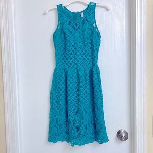 Knee length, lacey teal/blue dress